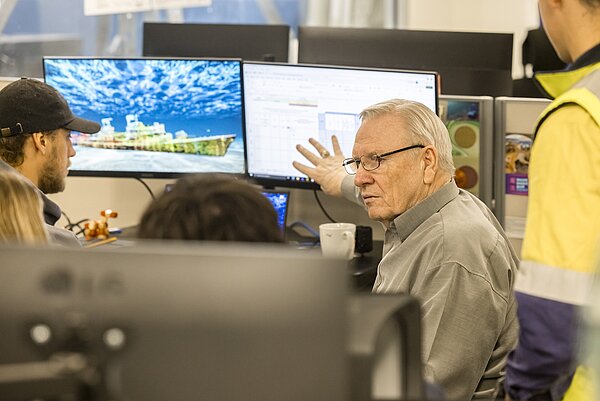 Hydrographic survey team receiving technical mentoring and project guidance