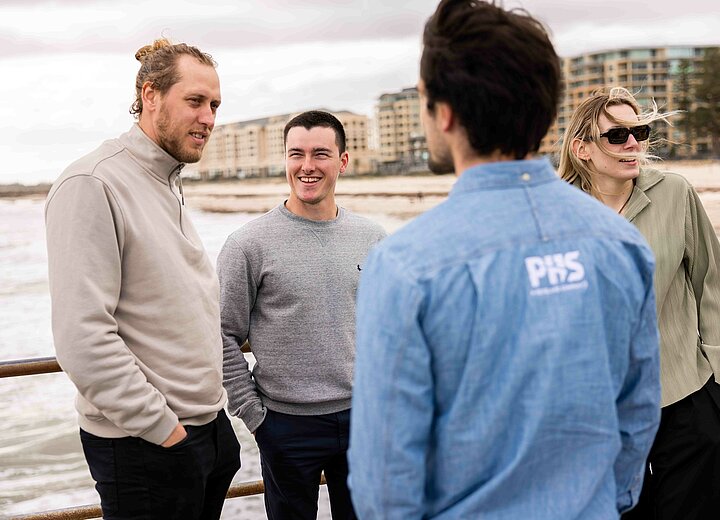 Revelare Hydrospatial employees in Adelaide smiling on a pier