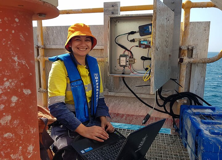 Hydrographic Surveyor Jennifer Brindle working onsite connecting to an RTK Base Station in Port Hedland