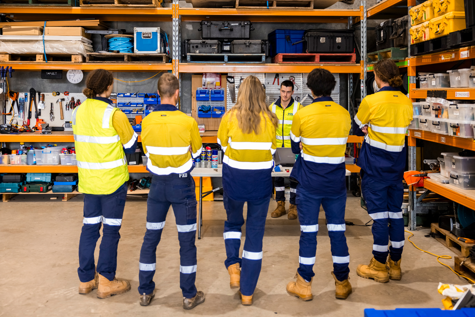 A group of people in an engineering workshop