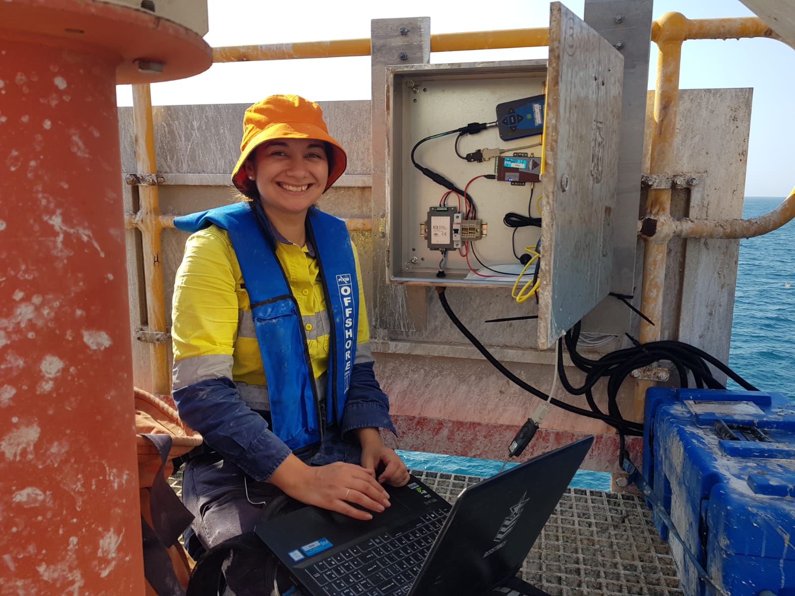 Hydrographic Surveyor Jennifer Brindle working onsite connecting to an RTK Base Station in Port Hedland
