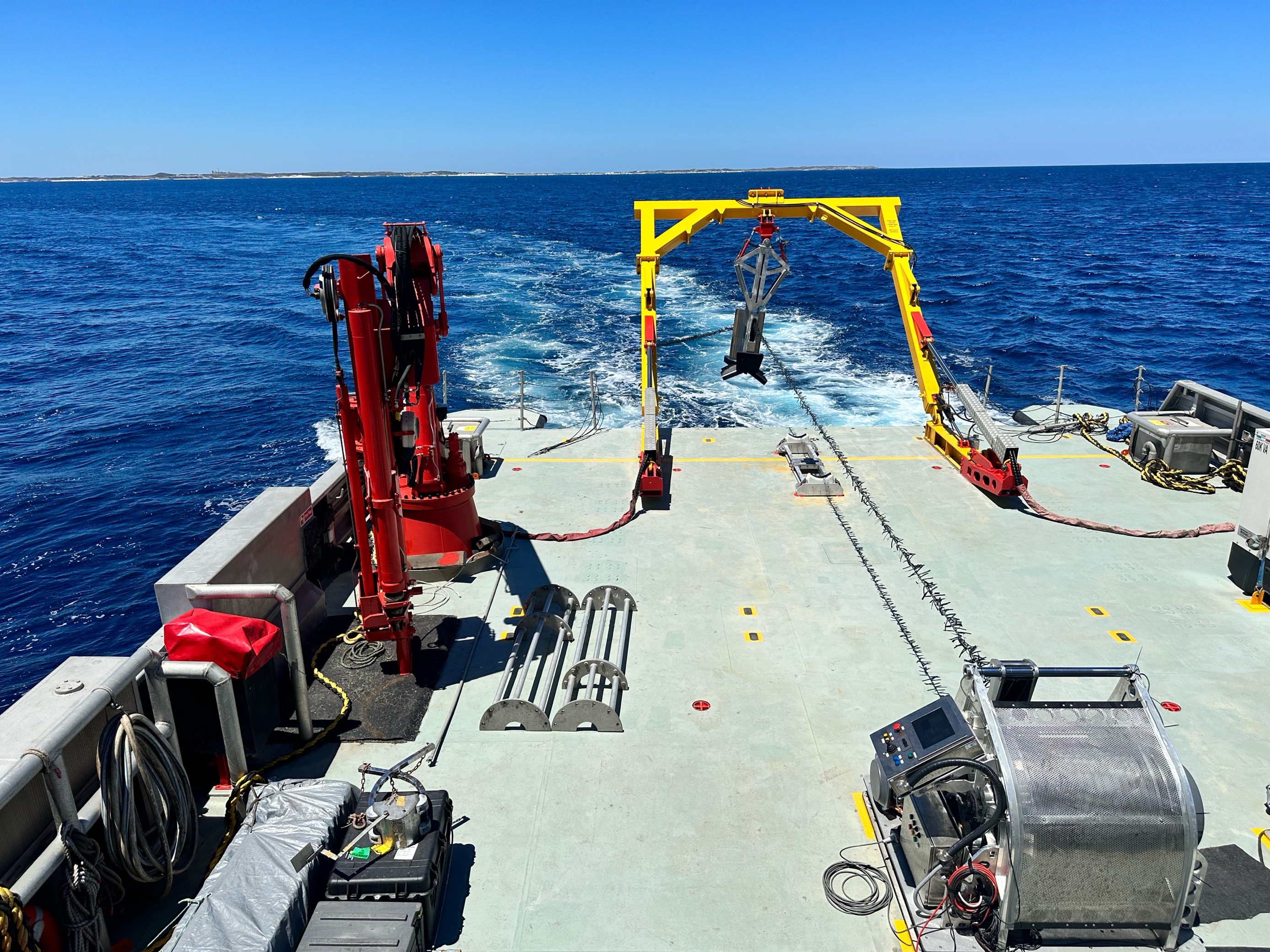 Survey vessel deck and hydrographic equipment during an offshore marine survey