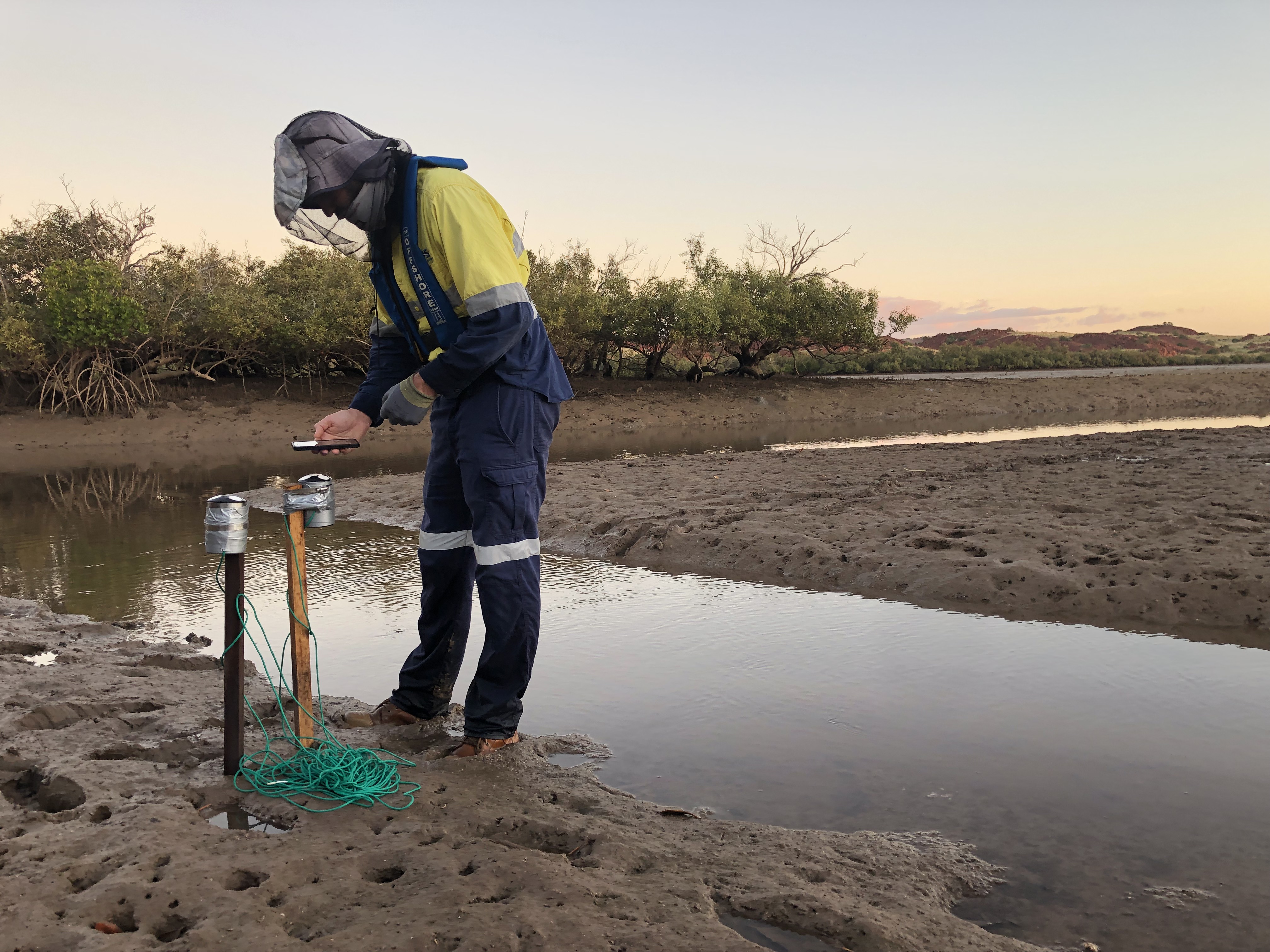 Hydrographic surveyor conducting fieldwork and environmental monitoring in a remote location