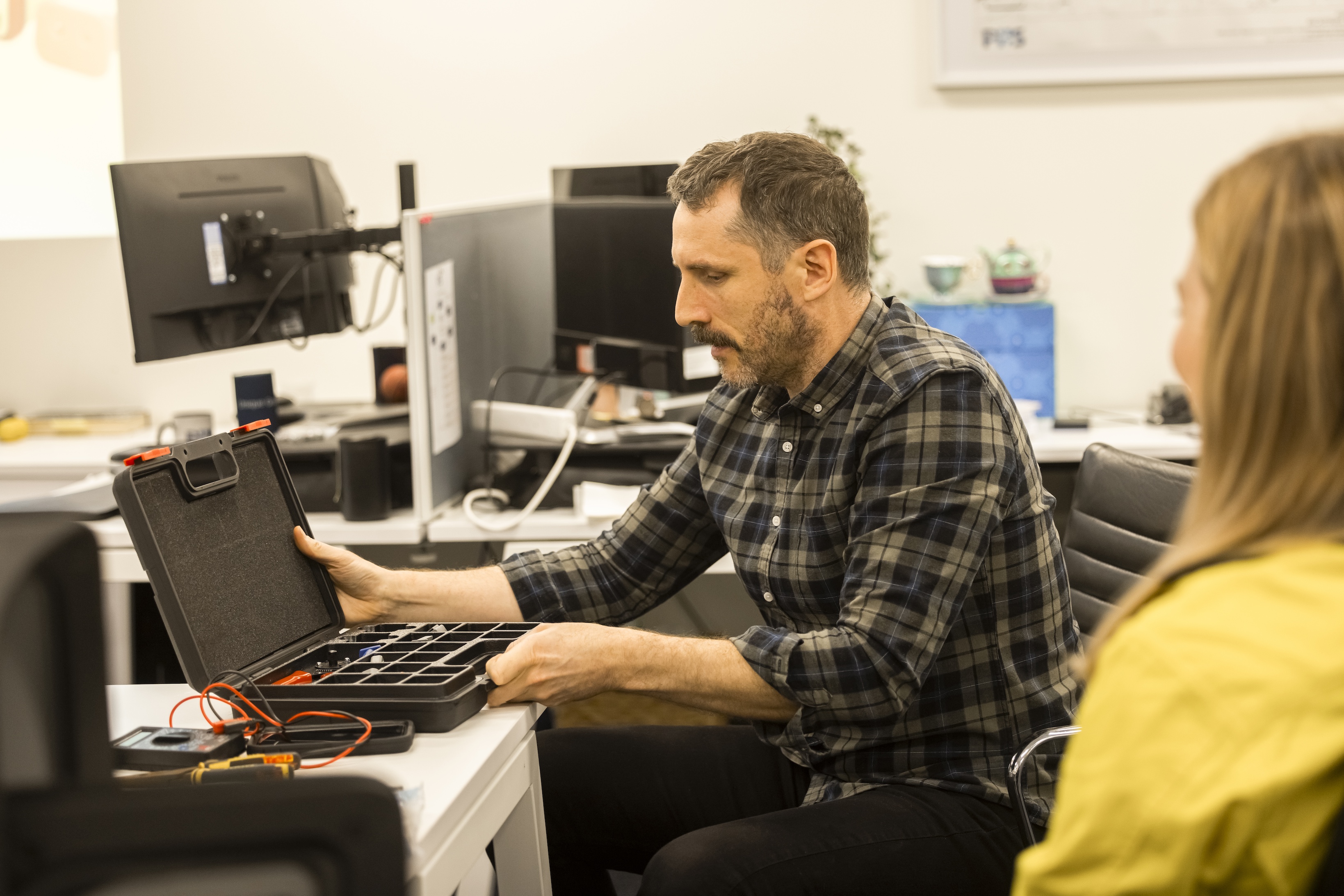 Hydrographic survey team receiving technical guidance and mentoring in the office