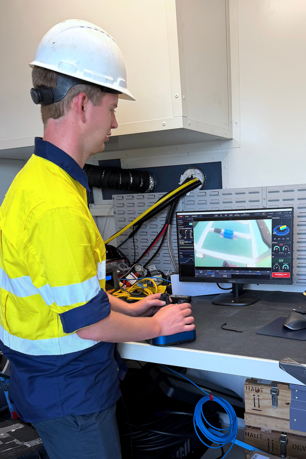 Revelare Hydrospatial team member operating the APAMA remotely operated vehicle during sea trials