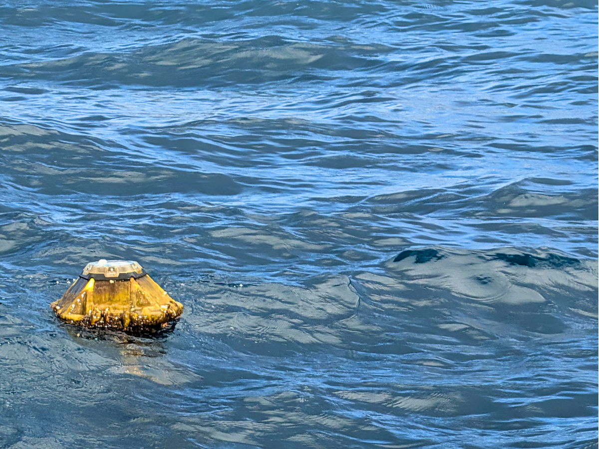 Spotter buoy floating at sea during a long-term offshore metocean monitoring deployment